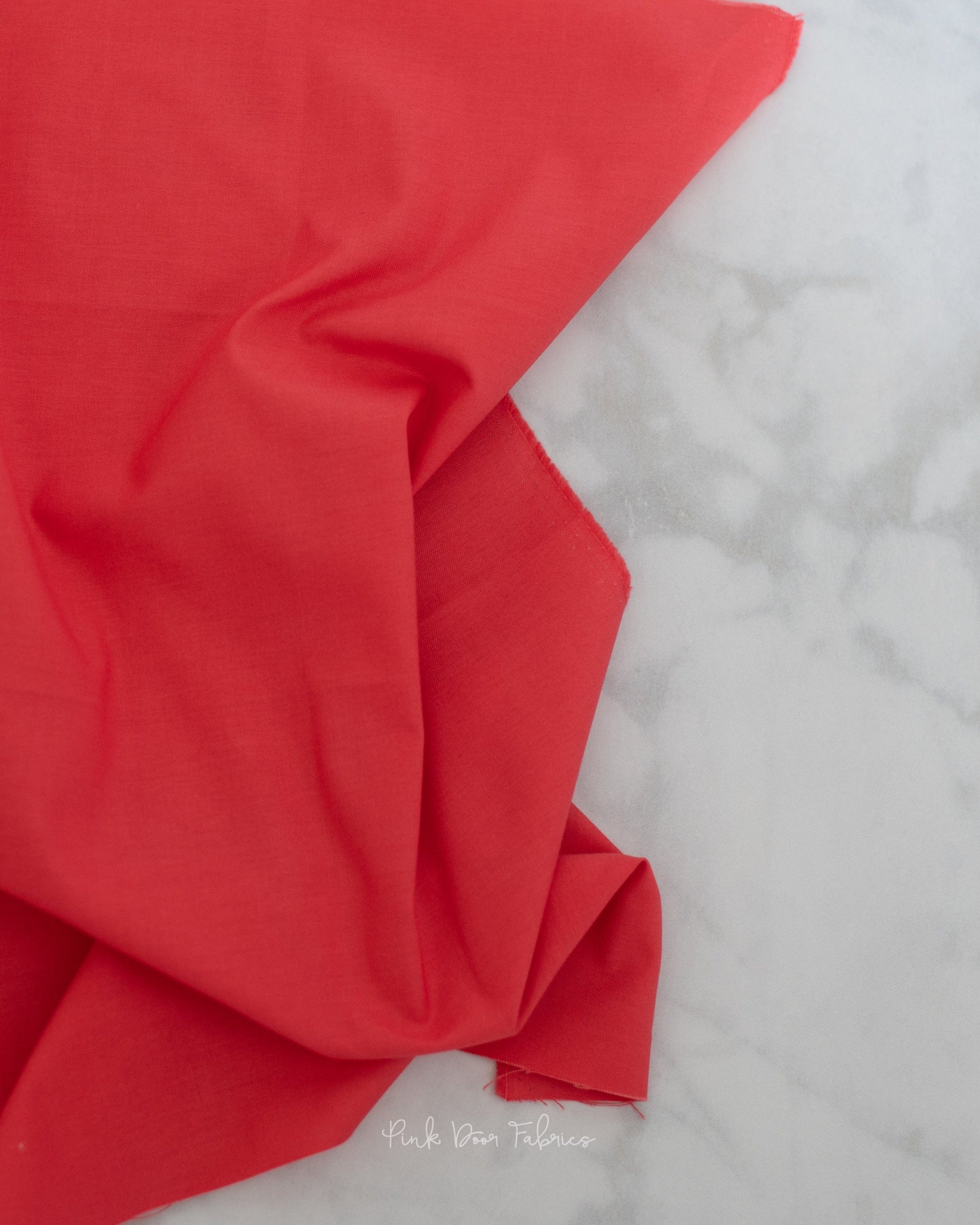 Cotton quilting fabric pattern called 'Solid in Cajun'. Part of the 'True Colors' fabric collection. Designed by Tula Pink for fabric company Free Spirit Fabrics. SKU: CSFSESS.CAJUN. 44-45 inch width.