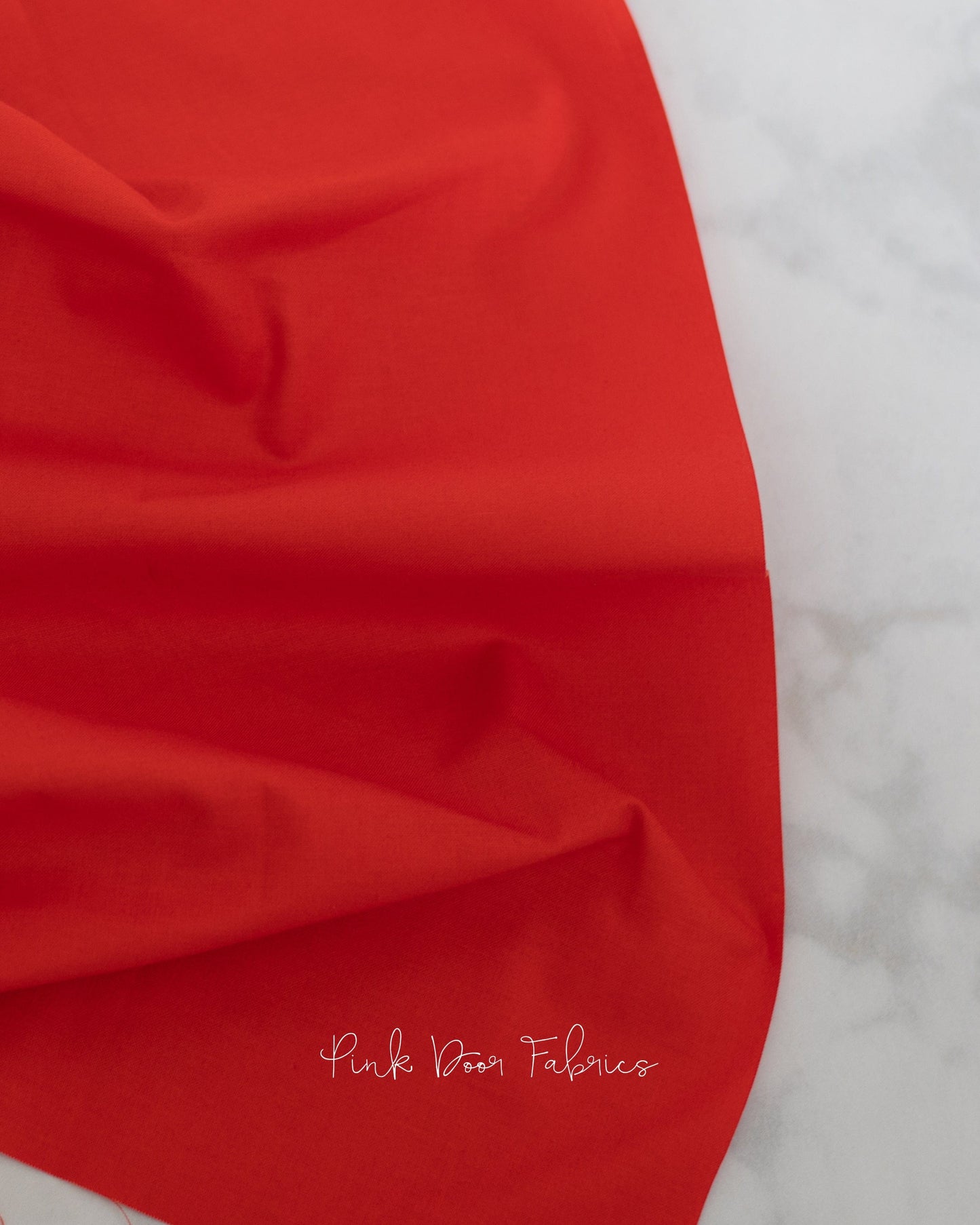 Cotton quilting fabric pattern called 'Dragon's Breath in Carnelian'. Part of the 'True Colors' fabric collection. Designed by Tula Pink for fabric company Free Spirit Fabrics. SKU: CSFSESS.CARNELIAN. 44-45 inch width.