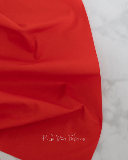 Cotton quilting fabric pattern called 'Dragon's Breath in Carnelian'. Part of the 'True Colors' fabric collection. Designed by Tula Pink for fabric company Free Spirit Fabrics. SKU: CSFSESS.CARNELIAN. 44-45 inch width.