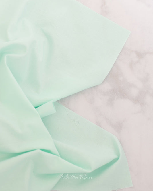 Cotton quilting fabric pattern called 'Solid in Glacier'. Part of the 'True Colors' fabric collection. Designed by Tula Pink for fabric company Free Spirit Fabrics. SKU: CSFSESS.GLACIER. 44-45 inch width.