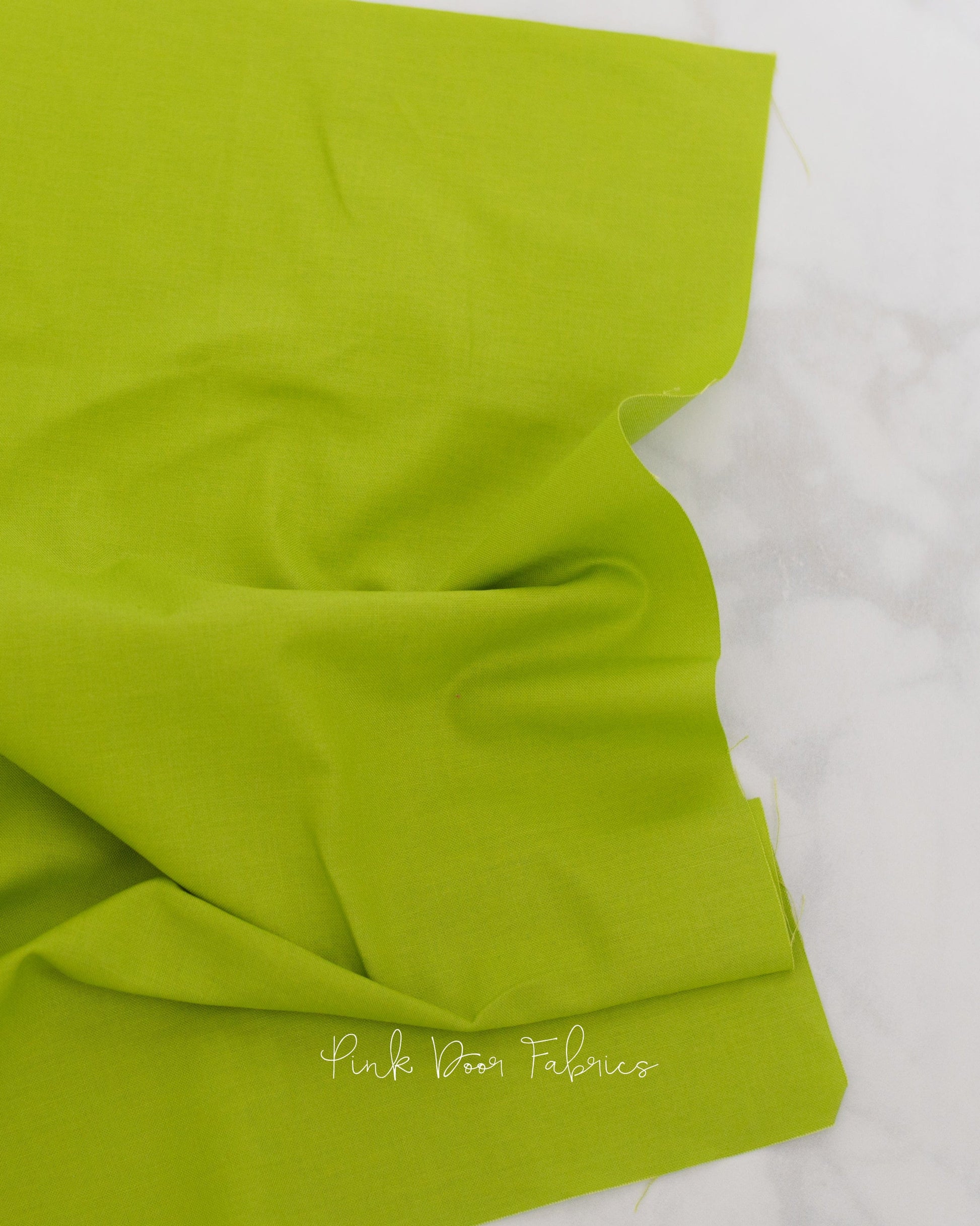 Cotton quilting fabric pattern called 'Dragon's Breath in Matcha'. Part of the 'True Colors' fabric collection. Designed by Tula Pink for fabric company Free Spirit Fabrics. SKU: CSFSESS.MATCH. 44-45 inch width.