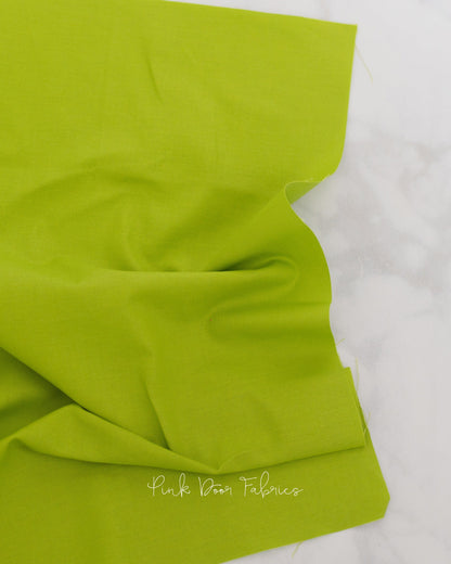 Cotton quilting fabric pattern called 'Dragon's Breath in Matcha'. Part of the 'True Colors' fabric collection. Designed by Tula Pink for fabric company Free Spirit Fabrics. SKU: CSFSESS.MATCH. 44-45 inch width.