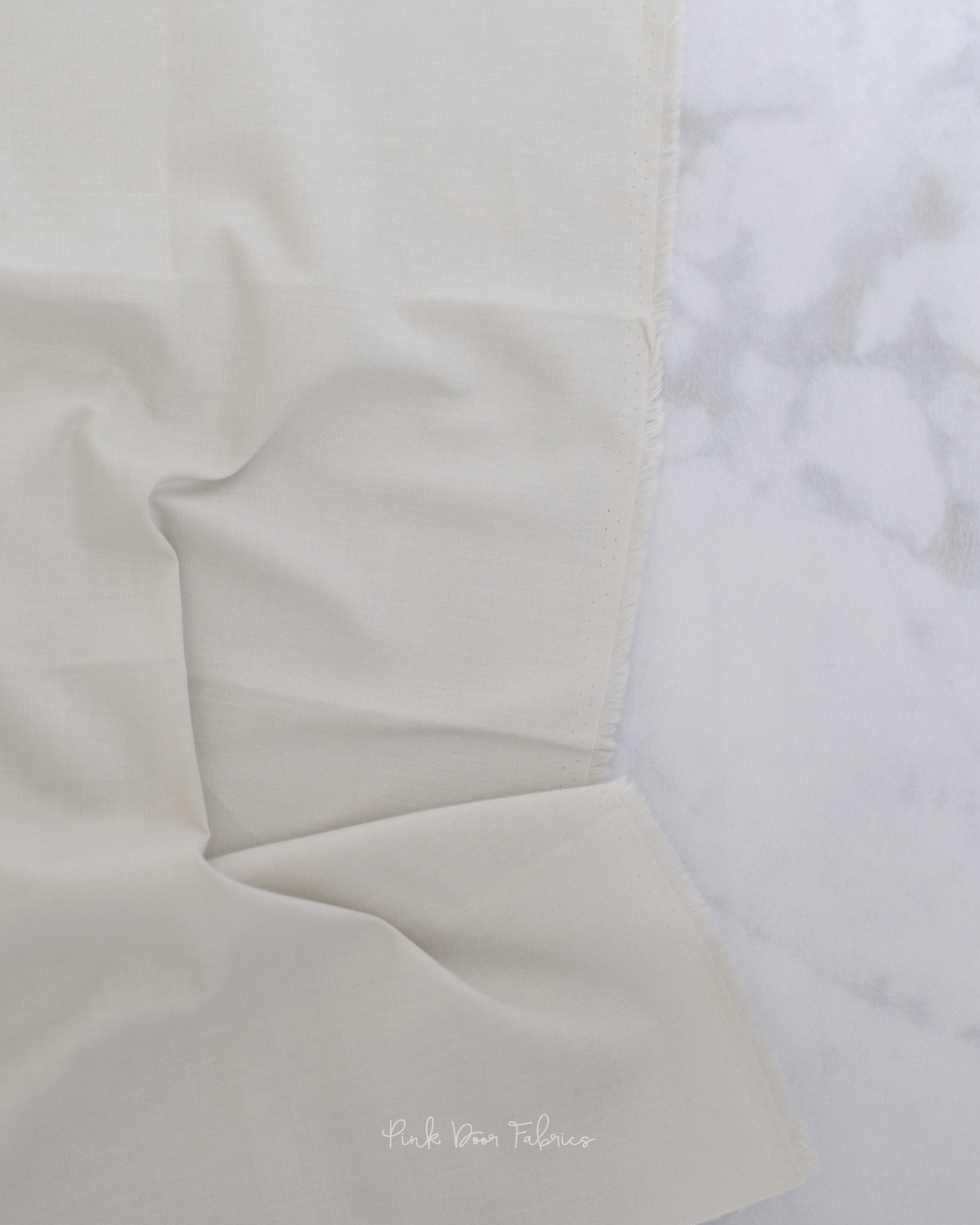 Cotton quilting fabric pattern called 'Solid in Putty'. Part of the 'True Colors' fabric collection. Designed by Tula Pink for fabric company Free Spirit Fabrics. SKU: CSFSESS.PUTTY. 44-45 inch width.