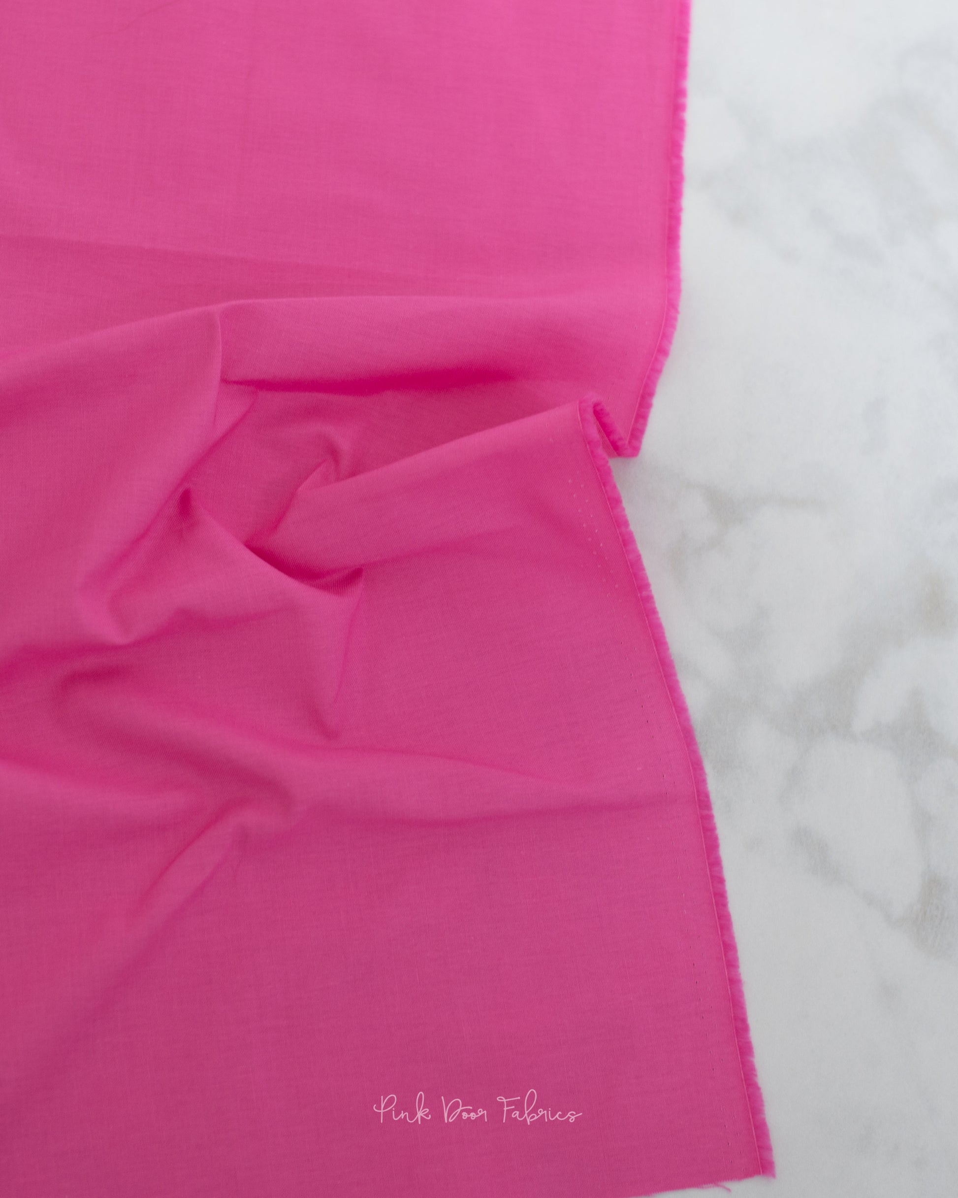 Cotton quilting fabric pattern called 'Solid in Tula Pink'. Part of the 'True Colors' fabric collection. Designed by Tula Pink for fabric company Free Spirit Fabrics. SKU: CSFSESS.TULA. 44-45 inch width.