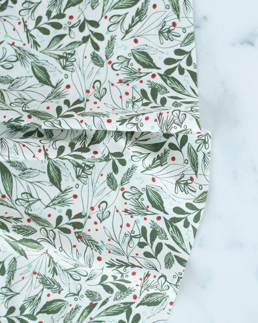 Cotton quilting fabric pattern called 'Winter Foliage in Natural'. Part of the 'Cheer & Merriment' fabric collection. Designed by Fancy That Design House for fabric company Moda Fabrics. SKU: 45534 11. 44-45 inch width.