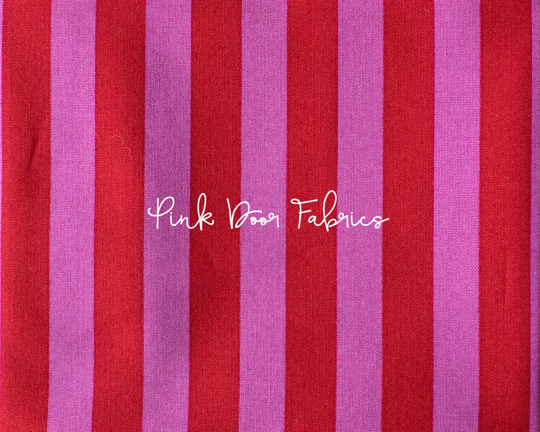 Cotton quilting fabric pattern called 'Tent Stripe in Peony'. Part of the 'True Colors' fabric collection. Designed by Tula Pink for fabric company Free Spirit Fabrics. SKU: PWTP069.PEONY. 44-45 inch width.