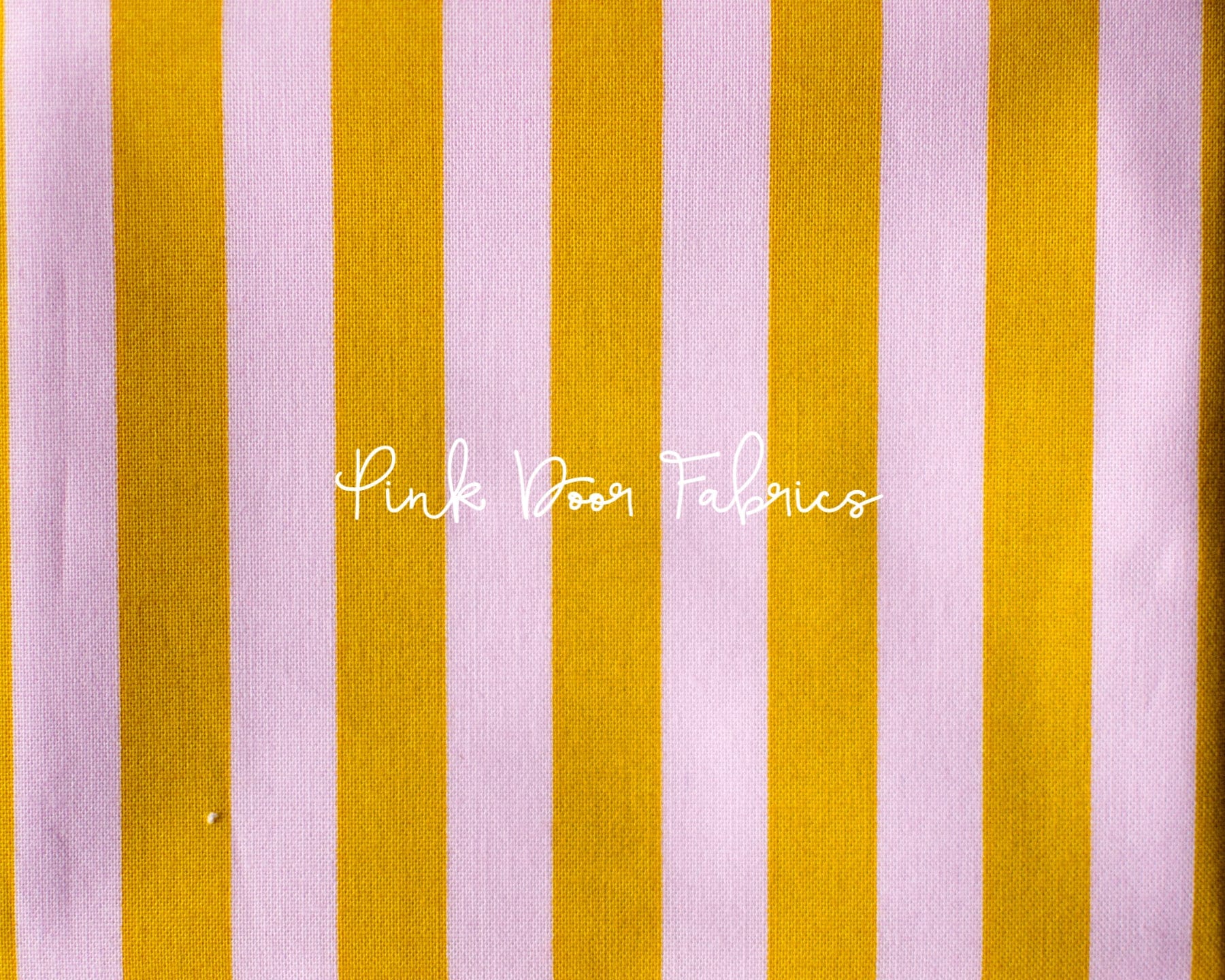 Cotton quilting fabric pattern called 'Tent Stripe in Marigold'. Part of the 'True Colors' fabric collection. Designed by Tula Pink for fabric company Free Spirit Fabrics. SKU: PWTP069.MARIGOLD. 44-45 inch width.