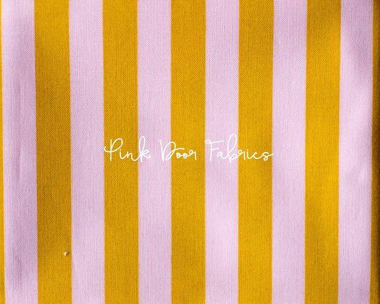 Cotton quilting fabric pattern called 'Tent Stripe in Marigold'. Part of the 'True Colors' fabric collection. Designed by Tula Pink for fabric company Free Spirit Fabrics. SKU: PWTP069.MARIGOLD. 44-45 inch width.