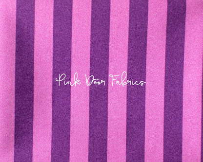 Cotton quilting fabric pattern called 'Tent Stripe in Foxglove'. Part of the 'True Colors' fabric collection. Designed by Tula Pink for fabric company Free Spirit Fabrics. SKU: PWTP069.FOXGLOVE. 44-45 inch width.