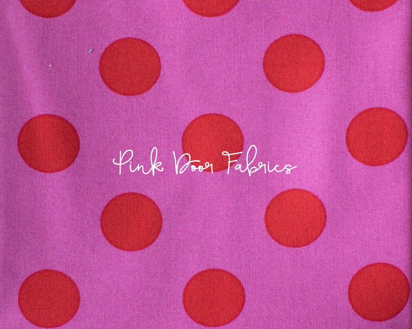 Cotton quilting fabric pattern called 'Pom Poms in Peony'. Part of the 'True Colors' fabric collection. Designed by Tula Pink for fabric company Free Spirit Fabrics. SKU: PWTP118.PEONY. 44-45 inch width.