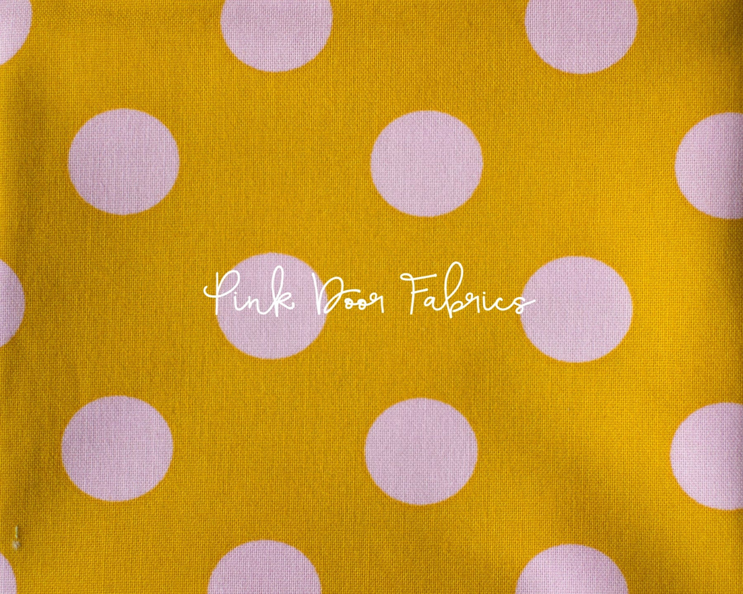 Cotton quilting fabric pattern called 'Pom Poms in Marigold'. Part of the 'True Colors' fabric collection. Designed by Tula Pink for fabric company Free Spirit Fabrics. SKU: PWTP118.MARIGOLD. 44-45 inch width.