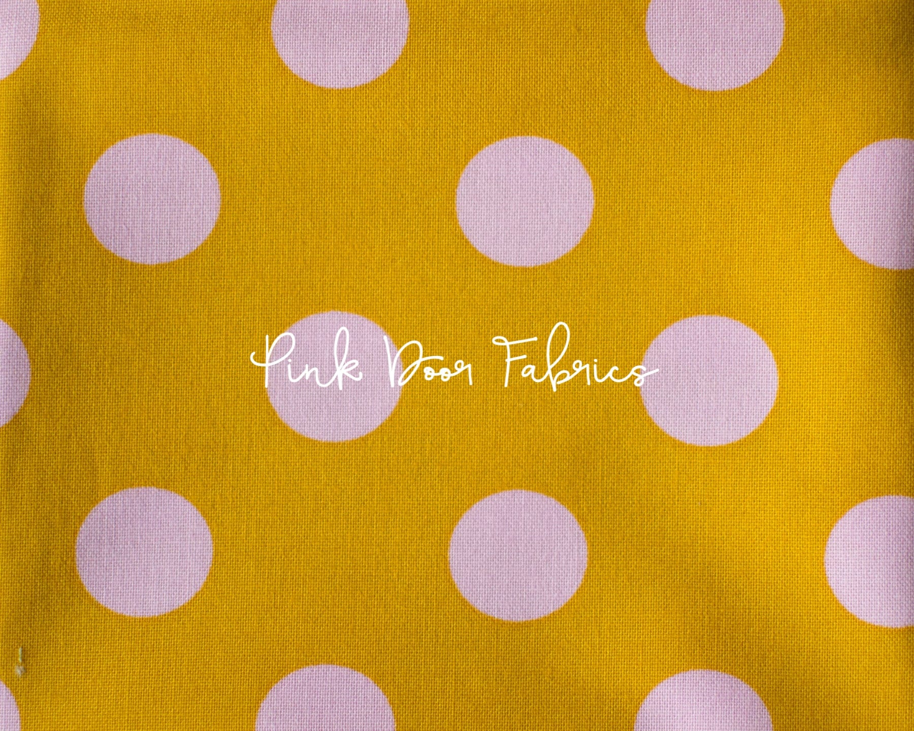 Cotton quilting fabric pattern called 'Pom Poms in Marigold'. Part of the 'True Colors' fabric collection. Designed by Tula Pink for fabric company Free Spirit Fabrics. SKU: PWTP118.MARIGOLD. 44-45 inch width.