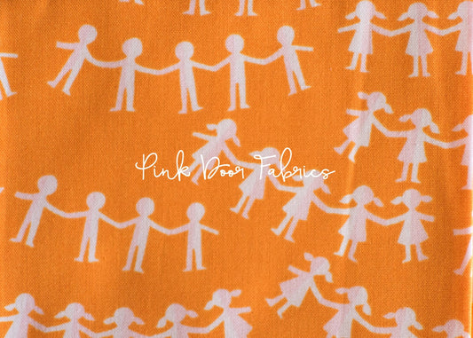 Cotton quilting fabric pattern called 'Paper Dolls in Orange'. Part of the 'Kinder' fabric collection. Designed by Heather Ross for fabric company Windham Fabrics. SKU: 43485-5. 44-45 inch width.