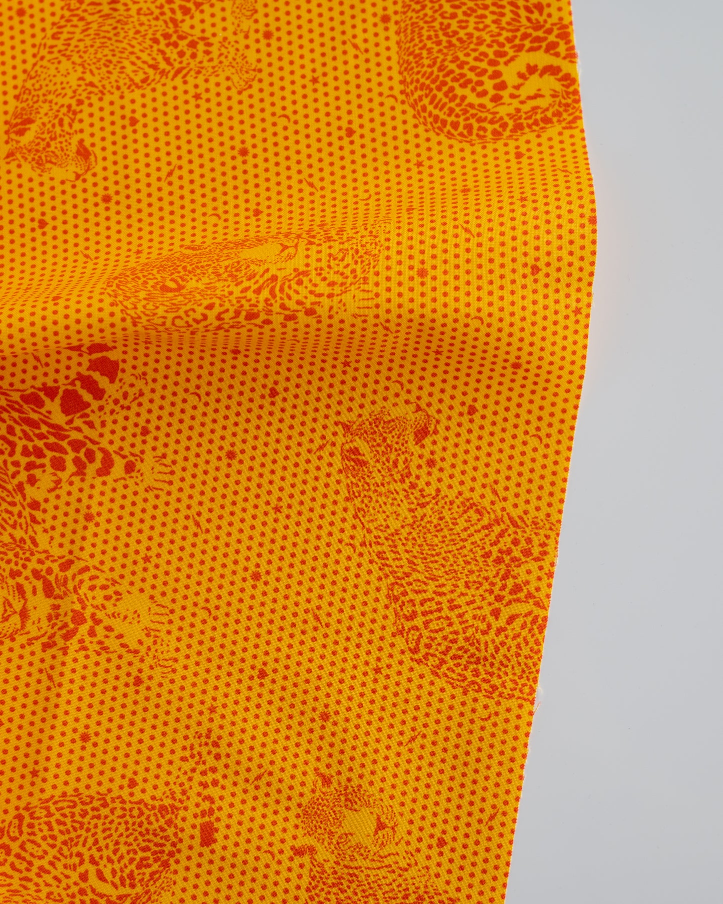 Cotton quilting fabric pattern called 'Lil' Jaguars in Papaya'. Part of the 'Daydreamer' fabric collection. Designed by Tula Pink for fabric company Free Spirit Fabrics. SKU: PWTP174.PAPAYA. 44-45 inch width.