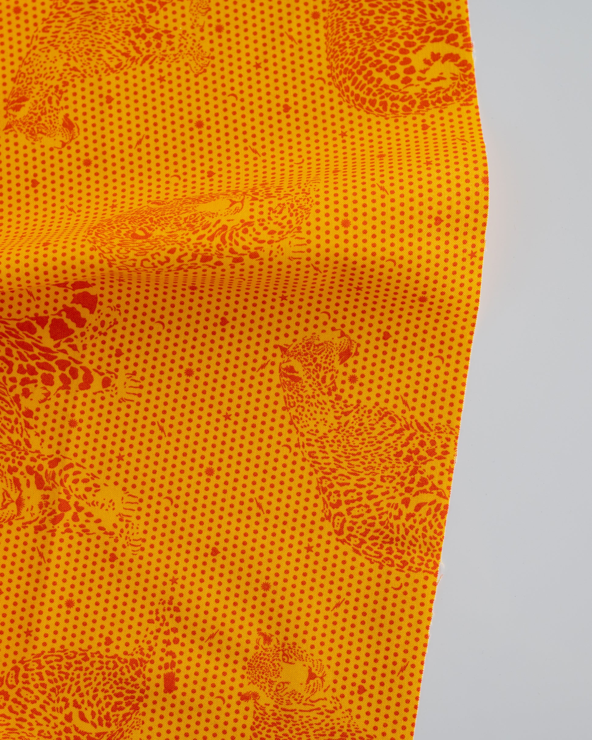 Cotton quilting fabric pattern called 'Lil' Jaguars in Papaya'. Part of the 'Daydreamer' fabric collection. Designed by Tula Pink for fabric company Free Spirit Fabrics. SKU: PWTP174.PAPAYA. 44-45 inch width.