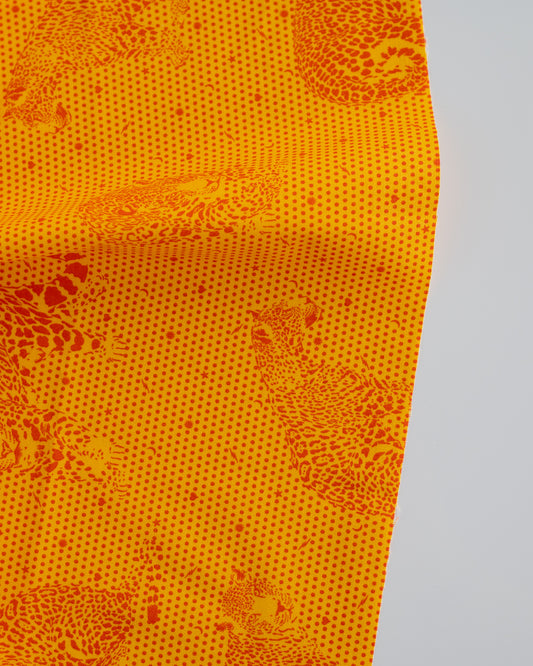 Cotton quilting fabric pattern called 'Lil' Jaguars in Papaya'. Part of the 'Daydreamer' fabric collection. Designed by Tula Pink for fabric company Free Spirit Fabrics. SKU: PWTP174.PAPAYA. 44-45 inch width.