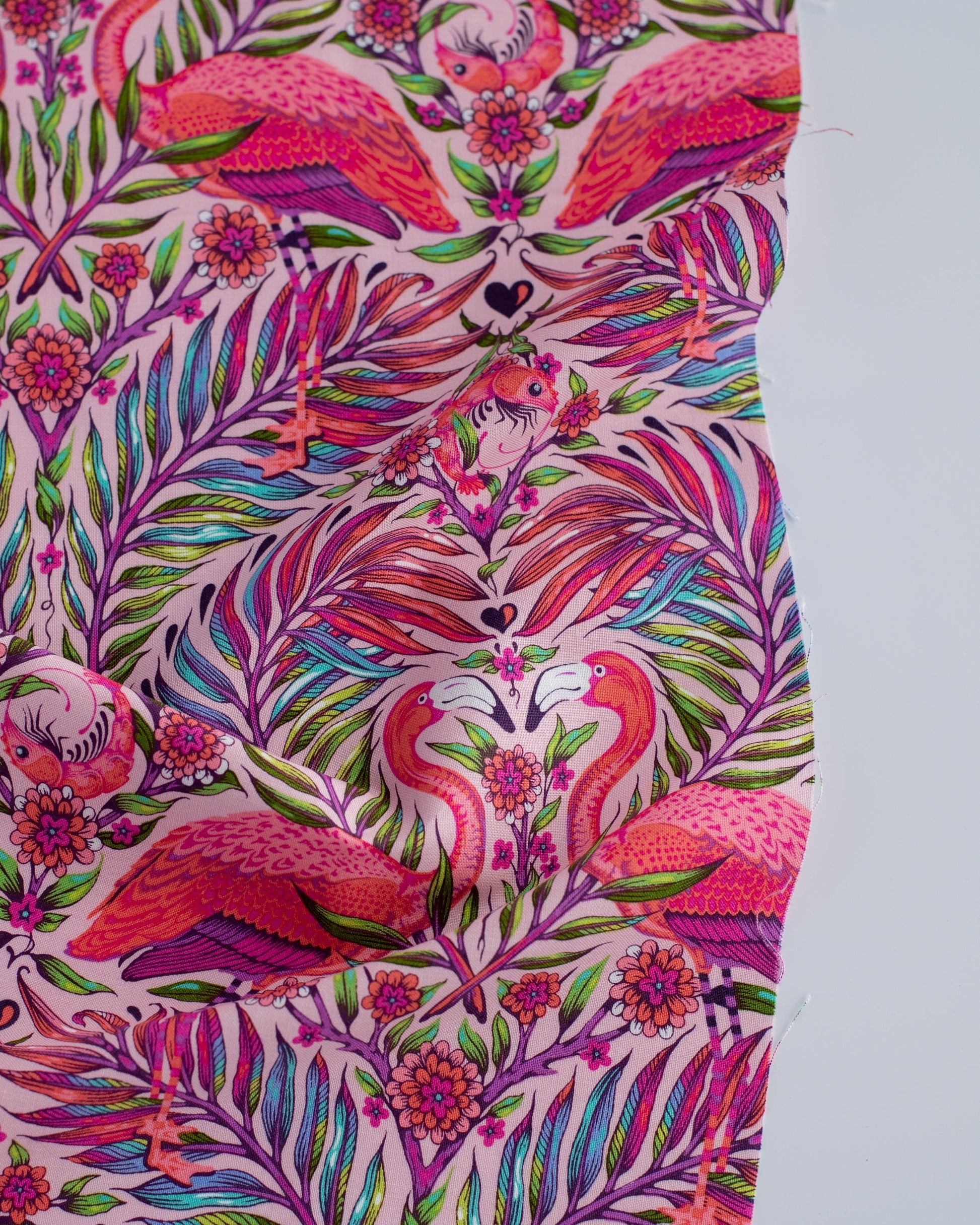 Cotton quilting fabric pattern called 'Pretty in Pink in Dragonfruit'. Part of the 'Daydreamer' fabric collection. Designed by Tula Pink for fabric company Free Spirit Fabrics. SKU: PWTP169.DRAGONFRUIT. 44-45 inch width.
