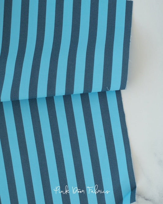 Cotton quilting fabric pattern called 'Tent Stripe in Aura'. Part of the '2023 True Colors' fabric collection. Designed by Tula Pink for fabric company Free Spirit Fabrics. SKU: PWTP069.AURA. 44-45 inch width.