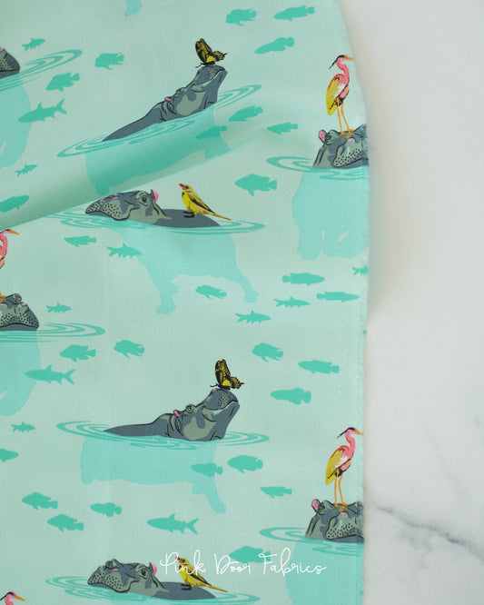 Cotton quilting fabric pattern called 'My Hippos Don't Lie in Spirit'. Part of the 'Everglow' fabric collection. Designed by Tula Pink for fabric company Free Spirit Fabrics. SKU: PWTP204.SPIRIT. 44-45 inch width.