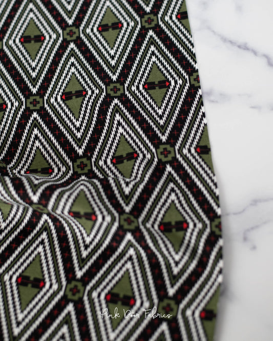 Cotton flannel quilting fabric pattern called 'Family Tree in Pine Fresh'. Part of the 'Holiday Homies flannel' fabric collection. Designed by Tula Pink for the Free Spirit Fabrics fabric company. SKU: FNTP004.PINEFRESH. 44-45 inch width.