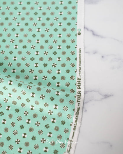 Cotton flannel quilting fabric pattern called 'Peppermint Stars in Pine Fresh'. Part of the 'Holiday Homies flannel' fabric collection. Designed by Tula Pink for the Free Spirit Fabrics fabric company. SKU: FNTP005.PINEFRESH. 44-45 inch width.