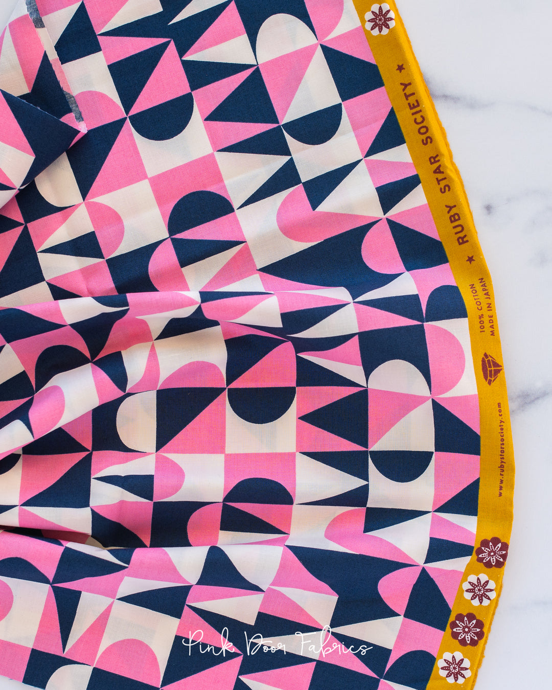 Cotton quilting fabric pattern called 'Building Blocks in Navy'. Part of the 'Floradora' fabric collection. Designed by Jen Hewett for fabric company Moda Fabrics. SKU: RS6024-12. 44-45 inch width.