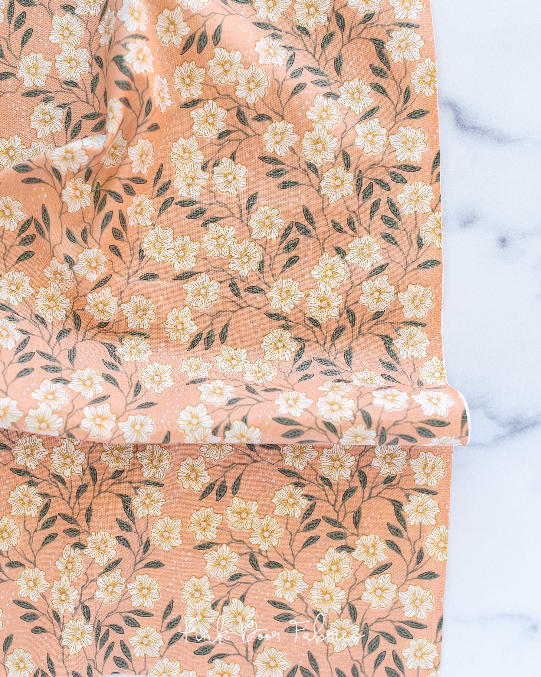 Cotton quilting fabric pattern called 'Wild Vines in Peach'. Part of the 'Get Out and Explore' fabric collection. Designed by Mint Tulip for fabric company Cotton + Steel. SKU: MT101-PE2. 44-45 inch width.