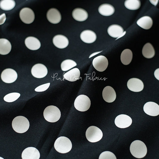 Cotton quilting fabric pattern called 'Pom Poms in Ink'. Part of the 'Linework' fabric collection. Designed by Tula Pink for fabric company Free Spirit Fabrics. SKU: PWTP118.INK. 44-45 inch width.