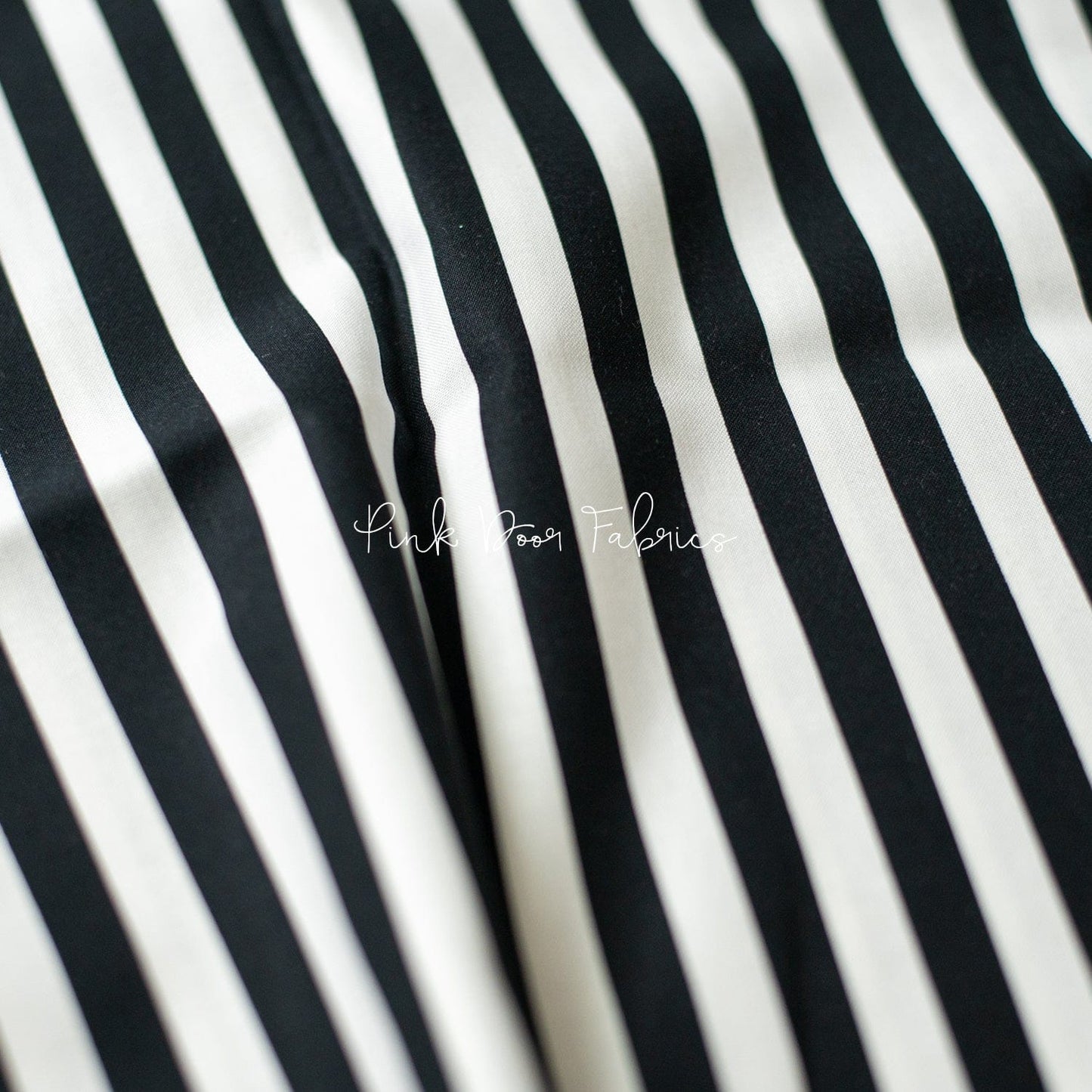 Cotton quilting fabric pattern called 'Tent Stripe in Paper'. Part of the 'Linework' fabric collection. Designed by Tula Pink for fabric company Free Spirit Fabrics. SKU: PWTP069.PAPER. 44-45 inch width.