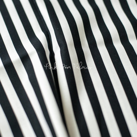 Cotton quilting fabric pattern called 'Tent Stripe in Paper'. Part of the 'Linework' fabric collection. Designed by Tula Pink for fabric company Free Spirit Fabrics. SKU: PWTP069.PAPER. 44-45 inch width.