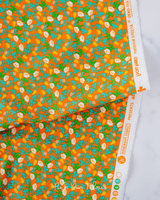 Cotton quilting fabric pattern called 'Calico in Orange'. Part of the 'Lucky Rabbit' fabric collection. Designed by Heather Ross for fabric company Windham Fabrics. SKU: 37027A-9. 44-45 inch width.