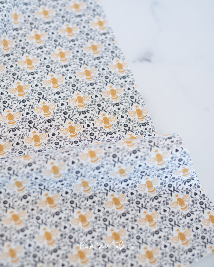 Cotton quilting fabric pattern called 'Honeybee Toile in Mist'. Part of the 'Midnight in the Garden' fabric collection. Designed by Fancy That Design House & Co. for fabric company Moda Fabrics. SKU: 43124 11. 44-45 inch width.
