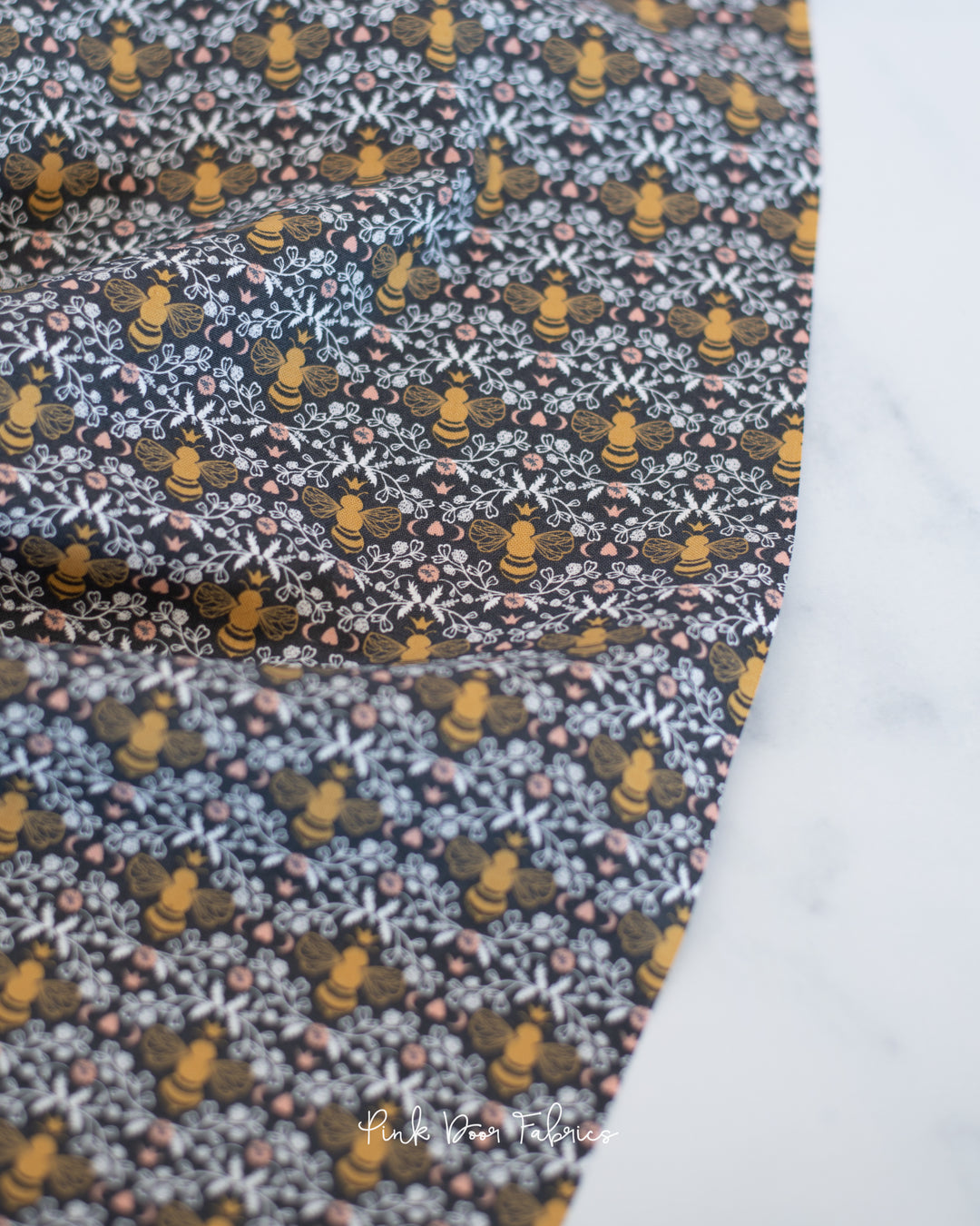 Cotton quilting fabric pattern called 'Honeybee Toile in Charcoal'. Part of the 'Midnight in the Garden' fabric collection. Designed by Fancy That Design House & Co. for fabric company Moda Fabrics. SKU: 43124 13. 44-45 inch width.