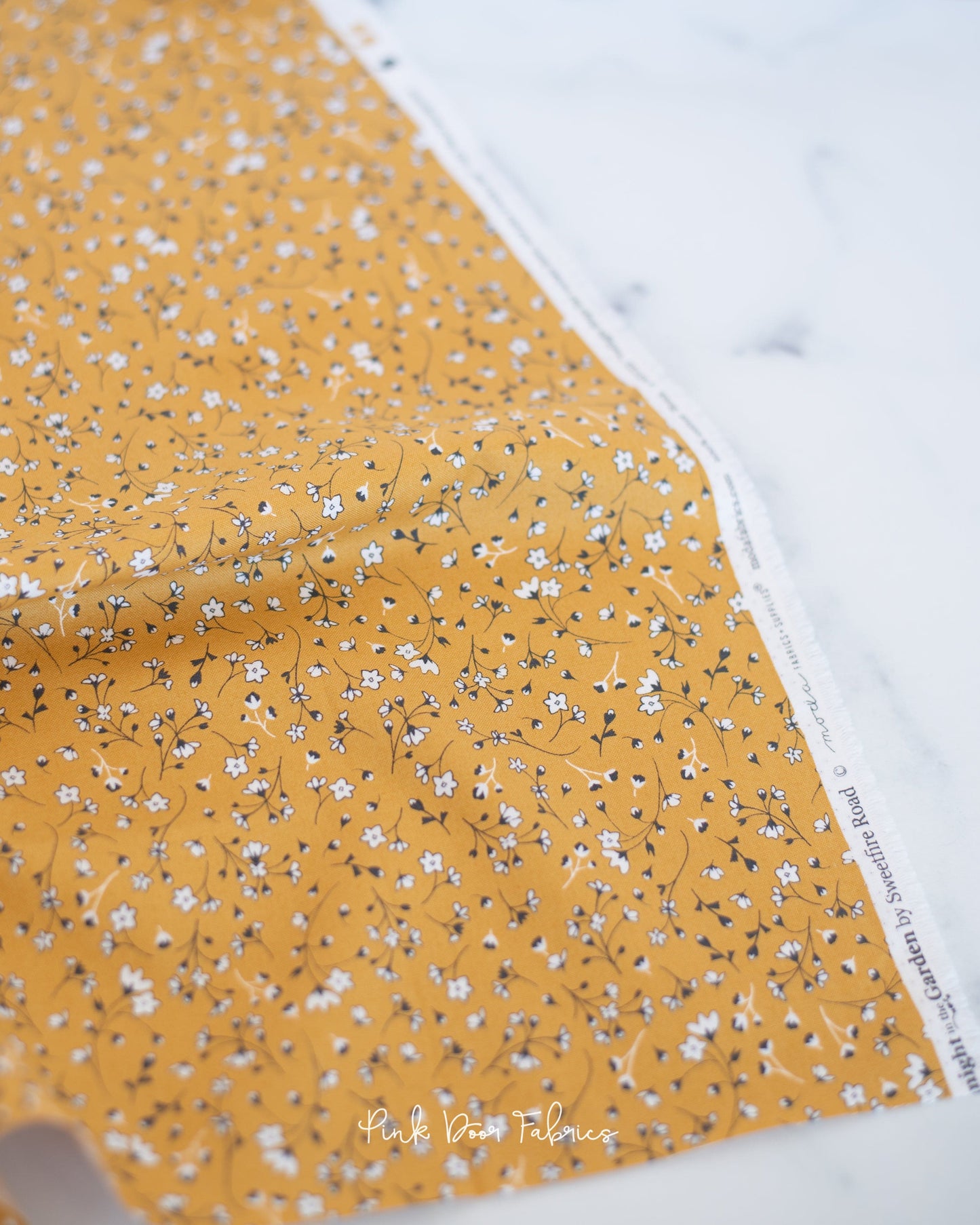 Cotton quilting fabric pattern called 'Pocketfull of Posies in Gold'. Part of the 'Midnight in the Garden' fabric collection. Designed by Fancy That Design House & Co. for fabric company Moda Fabrics. SKU: 43123 12. 44-45 inch width.