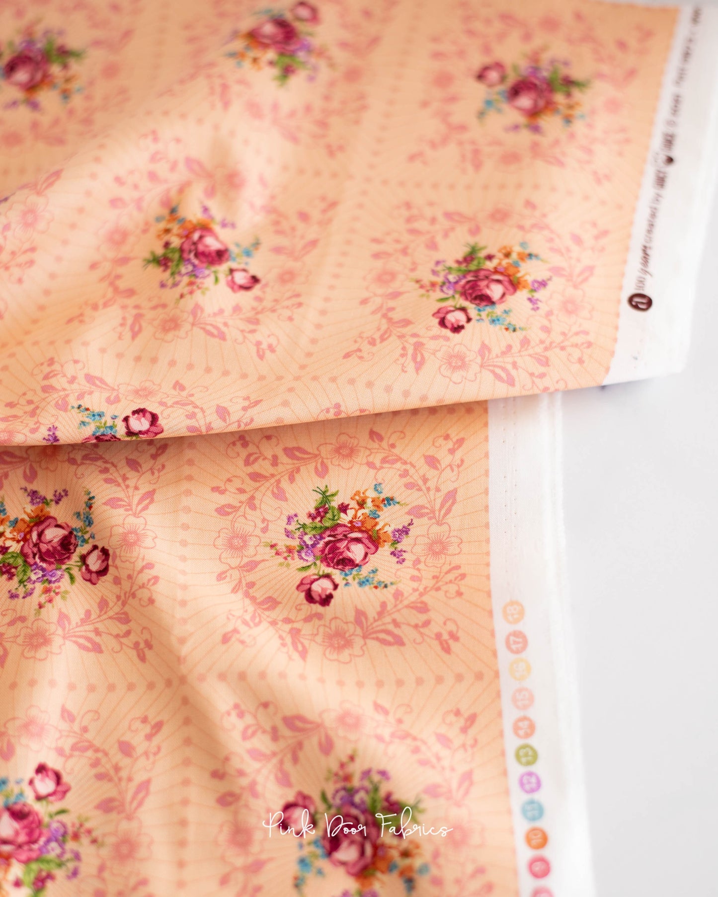 Cotton quilting fabric pattern called 'Wreath in Rosalia'. Part of the 'Nonna' fabric collection. Designed by Giucy Giuce for fabric company Andover Fabrics. SKU: A-9873-O. 44-45 inch width.