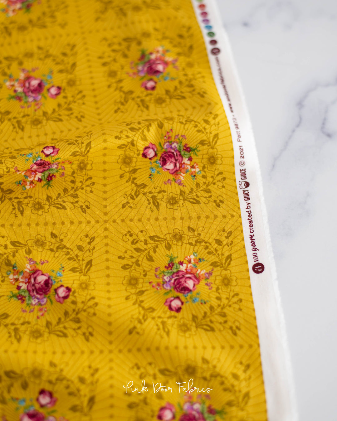 Cotton quilting fabric pattern called 'Wreath in Mustard'. Part of the 'Nonna' fabric collection. Designed by Giucy Giuce for fabric company Andover Fabrics. SKU: A-9873-Y. 44-45 inch width.