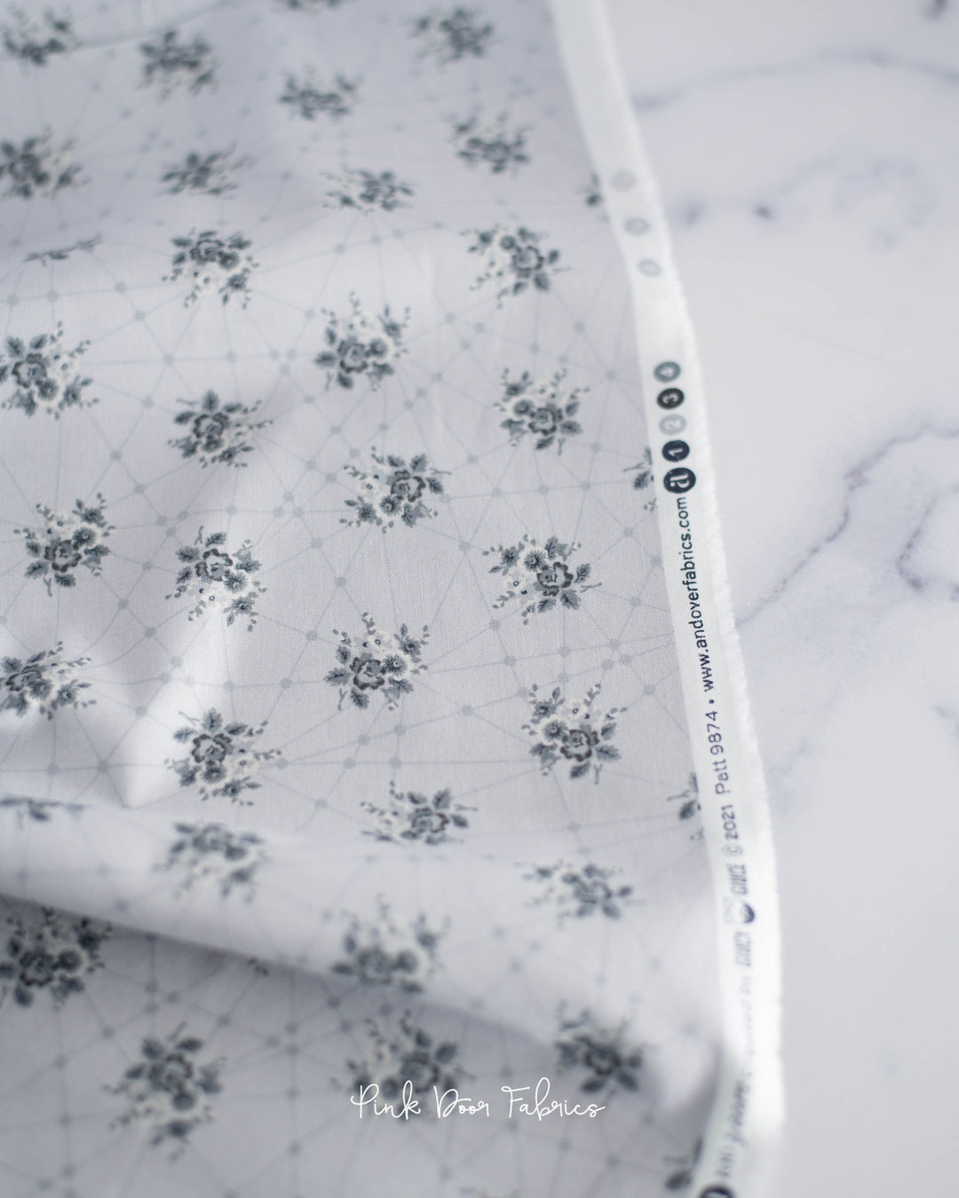 Cotton quilting fabric pattern called 'Little Bouquets in Classic Grey'. Part of the 'Nonna' fabric collection. Designed by Giucy Giuce for fabric company Andover Fabrics. SKU: A-9874-C. 44-45 inch width.