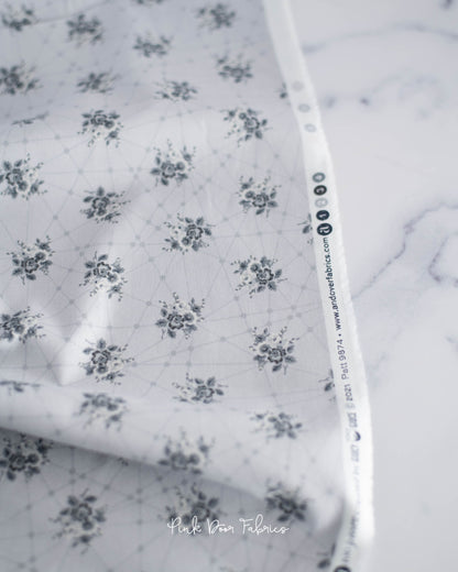 Cotton quilting fabric pattern called 'Little Bouquets in Classic Grey'. Part of the 'Nonna' fabric collection. Designed by Giucy Giuce for fabric company Andover Fabrics. SKU: A-9874-C. 44-45 inch width.