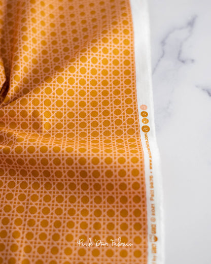 Cotton quilting fabric pattern called 'Caning in Peaches'. Part of the 'Nonna' fabric collection. Designed by Giucy Giuce for fabric company Andover Fabrics. SKU: A-9876-Y. 44-45 inch width.
