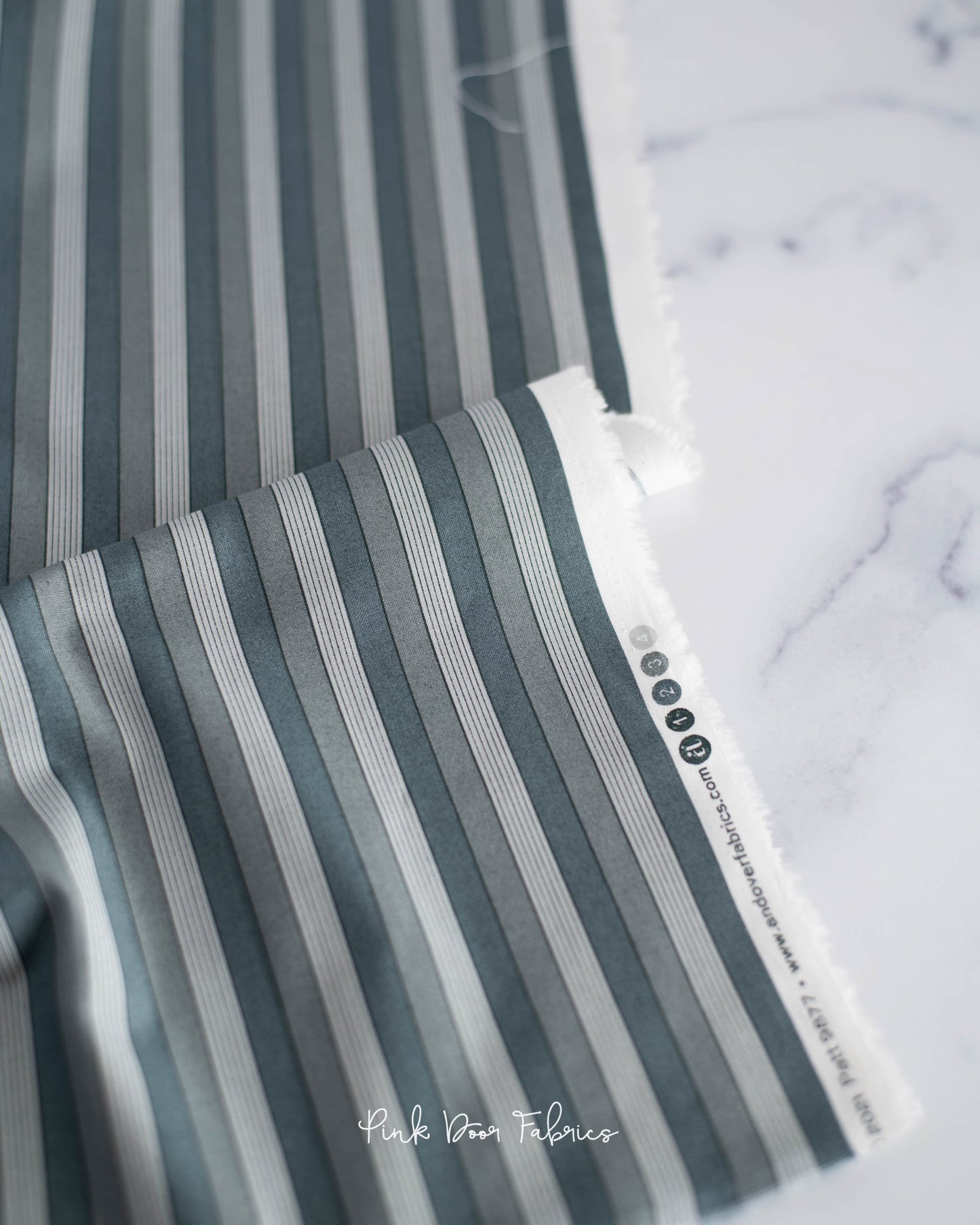 Cotton quilting fabric pattern called 'Onofrio in Grigio'. Part of the 'Nonna' fabric collection. Designed by Giucy Giuce for fabric company Andover Fabrics. SKU: A-9877-C. 44-45 inch width.