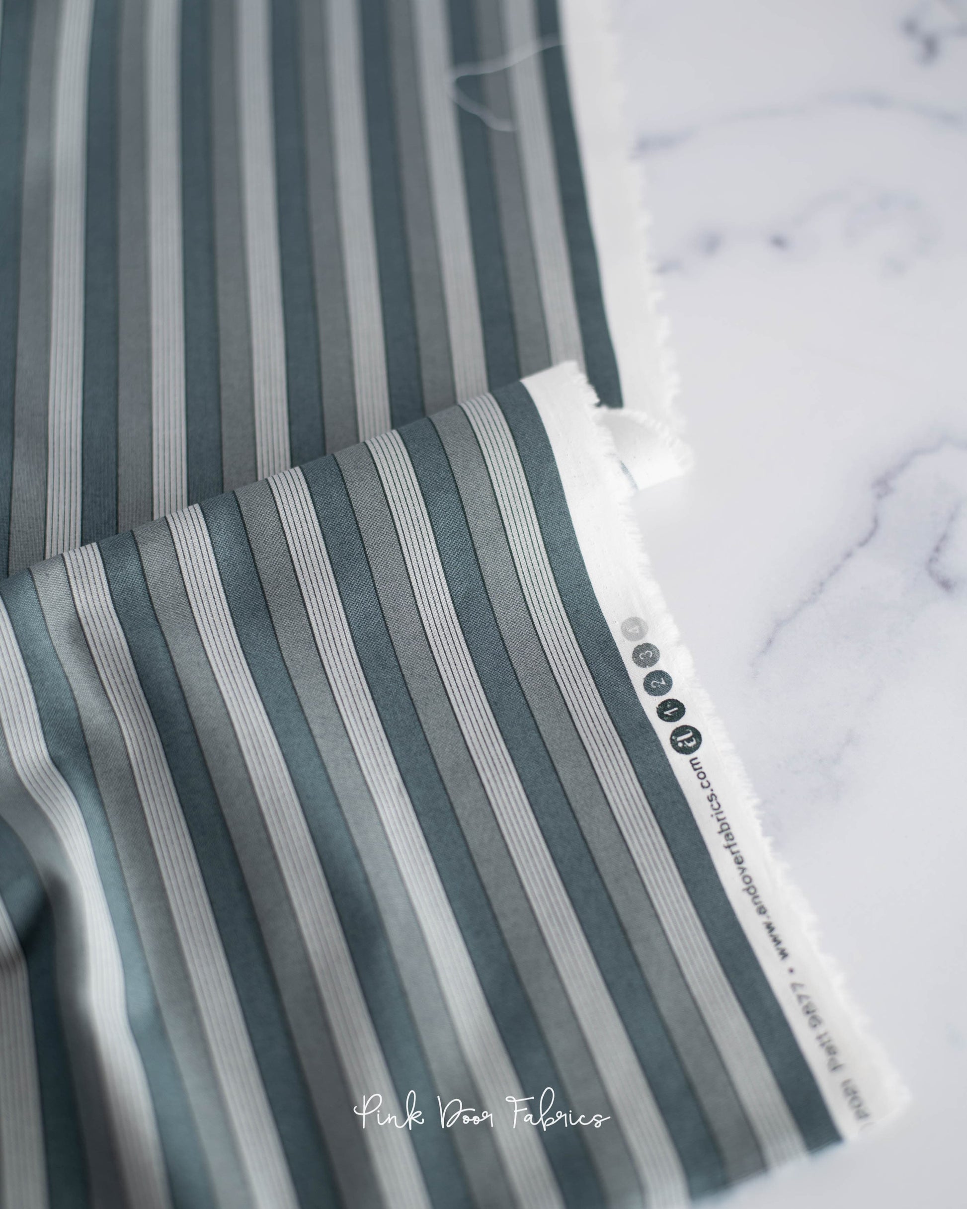 Cotton quilting fabric pattern called 'Onofrio in Grigio'. Part of the 'Nonna' fabric collection. Designed by Giucy Giuce for fabric company Andover Fabrics. SKU: A-9877-C. 44-45 inch width.