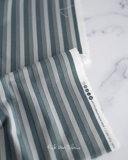 Cotton quilting fabric pattern called 'Onofrio in Grigio'. Part of the 'Nonna' fabric collection. Designed by Giucy Giuce for fabric company Andover Fabrics. SKU: A-9877-C. 44-45 inch width.