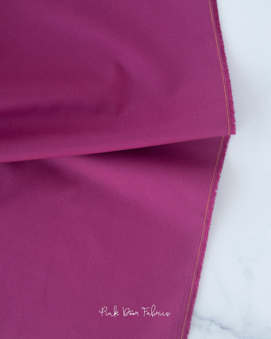 Cotton quilting fabric pattern called 'Solid in Sangria'. Part of the 'Colorworks Solids' fabric collection. Designed by Northcott Fabrics for fabric company Northcott Fabrics. SKU: 9000-844. 44-45 inch width.