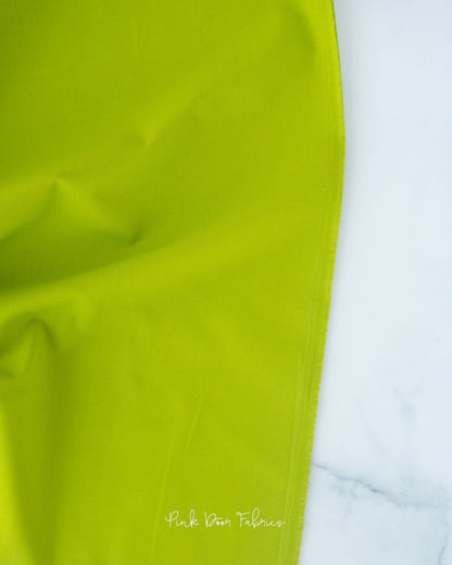 Cotton quilting fabric pattern called 'Solid in Matcha'. Part of the 'Colorworks Solids' fabric collection. Designed by Northcott Fabrics for fabric company Northcott Fabrics. SKU: 9000-726. 44-45 inch width.