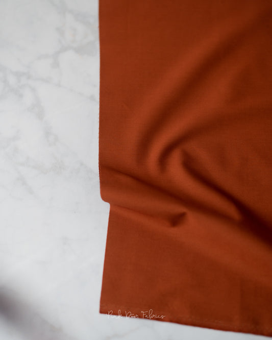 Cotton quilting fabric pattern called 'Chocolate'. Part of the 'Pure Solids' fabric collection. Designed by Art Gallery Fabrics for fabric company Art Gallery Fabrics. SKU: PE-422. 44-45 inch width.