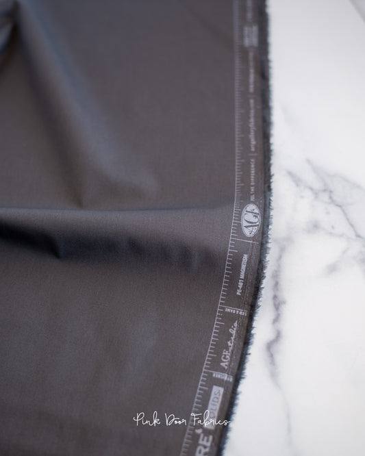 Cotton quilting fabric pattern called 'Magnetism'. Part of the 'Pure Solids' fabric collection. Designed by Art Gallery Fabrics for fabric company Art Gallery Fabrics. SKU: PE-481. 44-45 inch width.