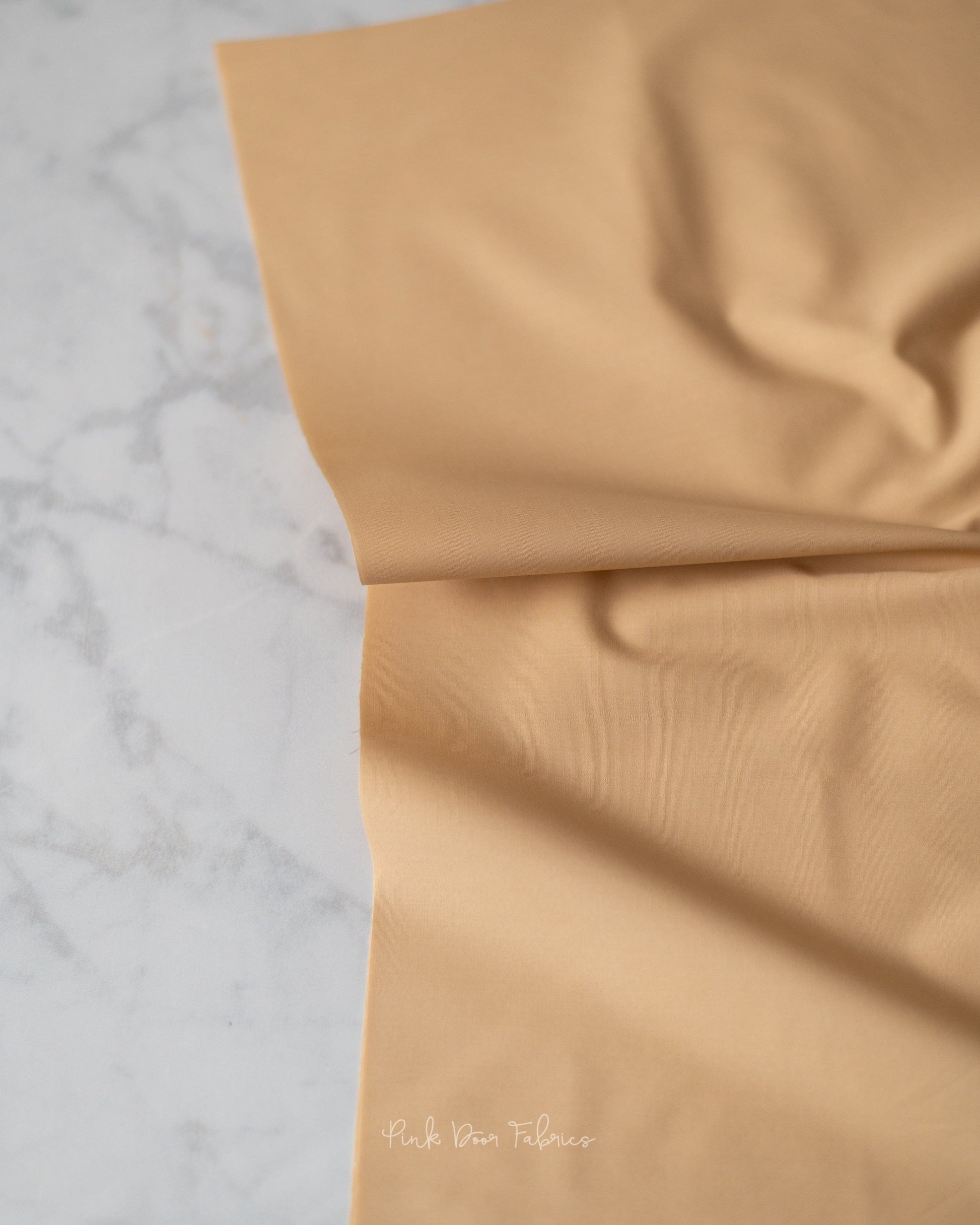 Cotton quilting fabric pattern called 'Vanilla Custard'. Part of the 'Pure Solids' fabric collection. Designed by Art Gallery Fabrics for fabric company Art Gallery Fabrics. SKU: PE-486. 44-45 inch width.