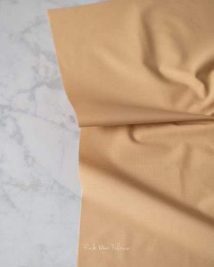 Cotton quilting fabric pattern called 'Vanilla Custard'. Part of the 'Pure Solids' fabric collection. Designed by Art Gallery Fabrics for fabric company Art Gallery Fabrics. SKU: PE-486. 44-45 inch width.