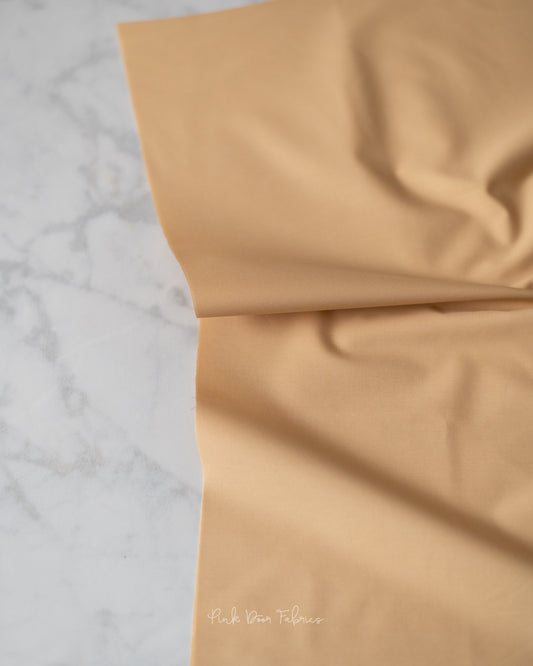 Cotton quilting fabric pattern called 'Vanilla Custard'. Part of the 'Pure Solids' fabric collection. Designed by Art Gallery Fabrics for fabric company Art Gallery Fabrics. SKU: PE-486. 44-45 inch width.