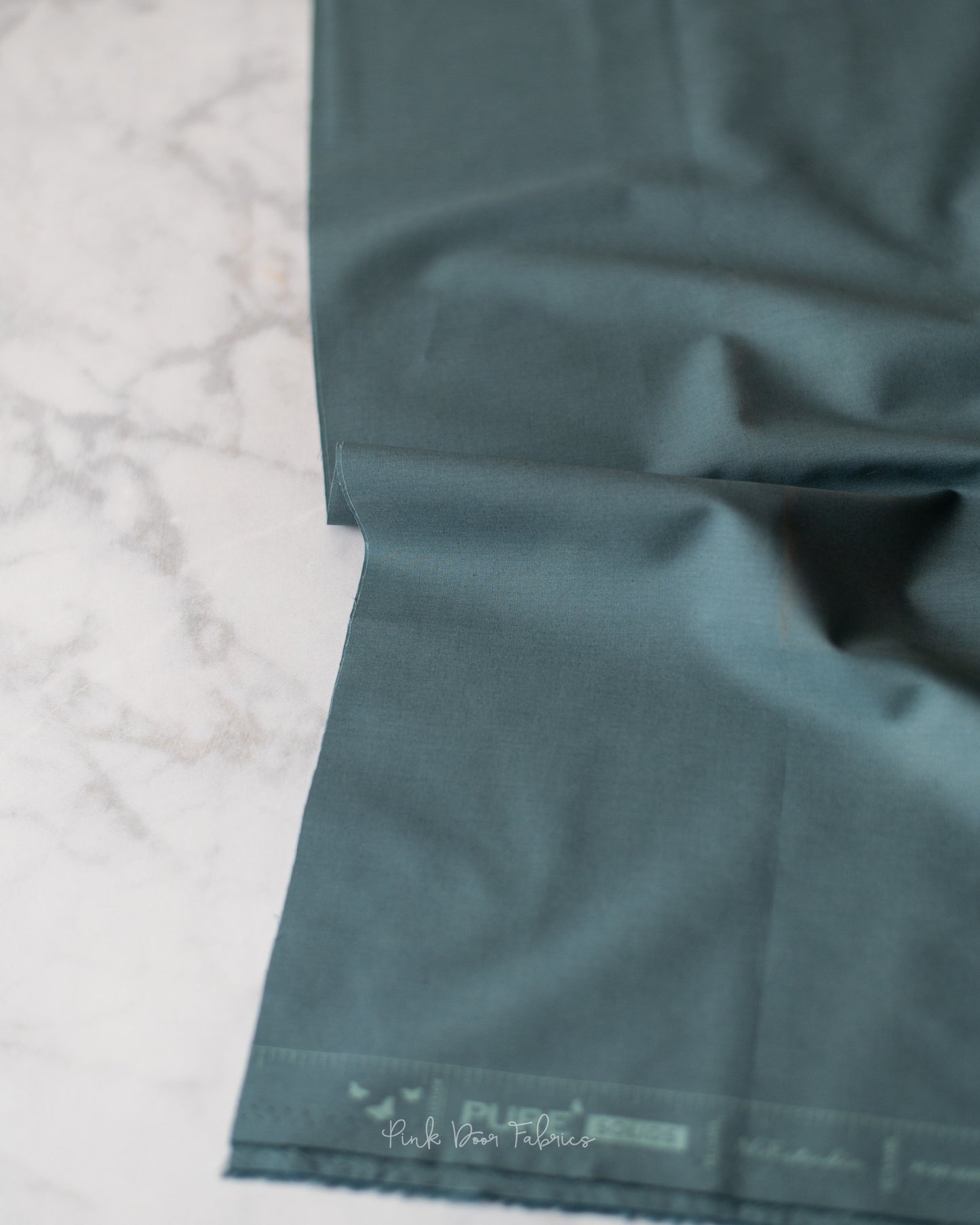 Cotton quilting fabric pattern called 'Northern Waters'. Part of the 'Pure Solids' fabric collection. Designed by Art Gallery Fabrics for fabric company Art Gallery Fabrics. SKU: PE-501. 44-45 inch width.